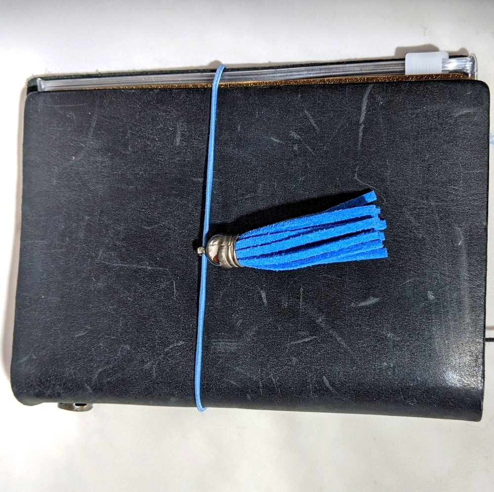 Passport size black leather travelers notebook